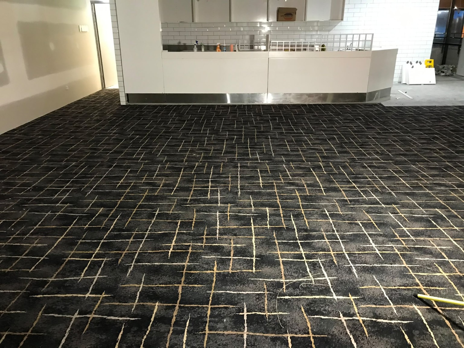Patterned carpet installed across a commercial reception area