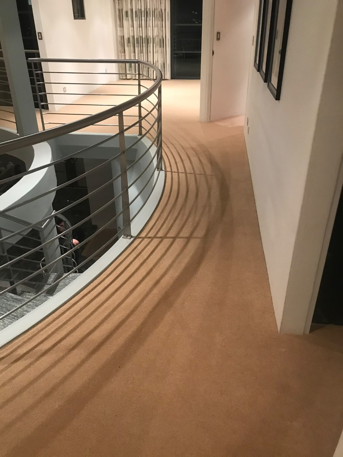 Carpet installed through a curved commercial corridor